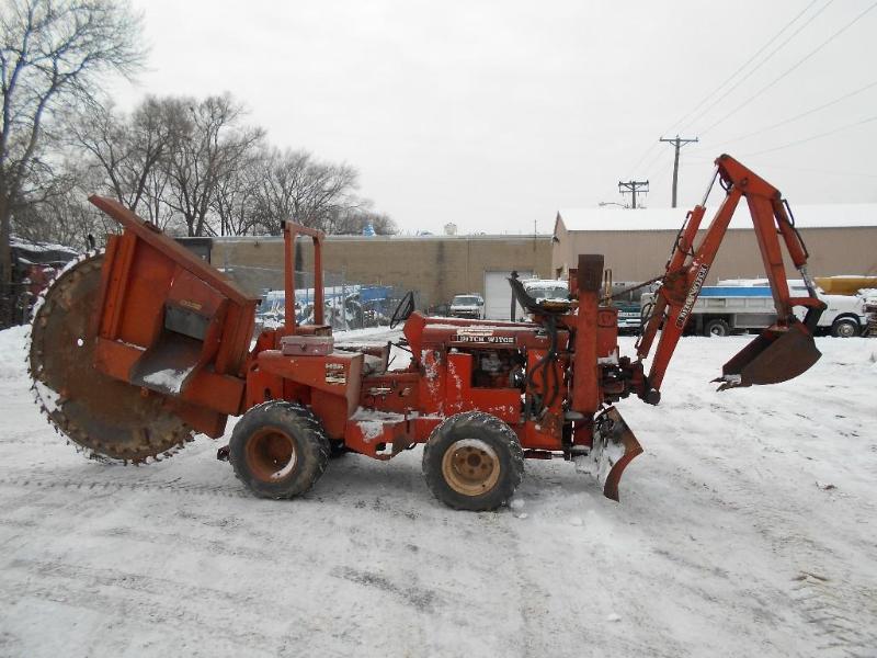 lot 5 image: Ditch Witch R65 4X4 Rock Saw  Backhoe.