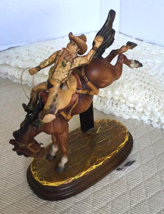 lot 138 image: Anri woodcarving Cowboy riding bucking horse ...