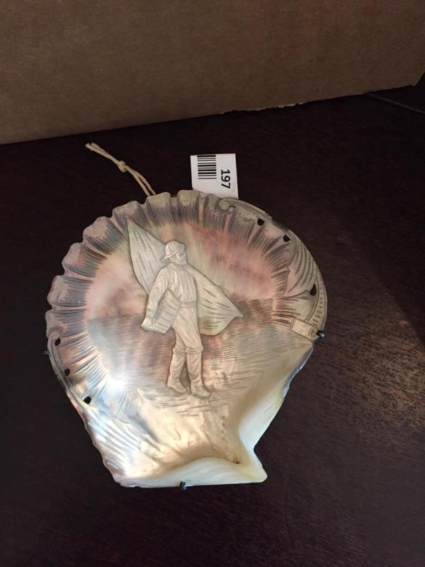 lot 197 image: A relief carved mother of pearl shell depicti...