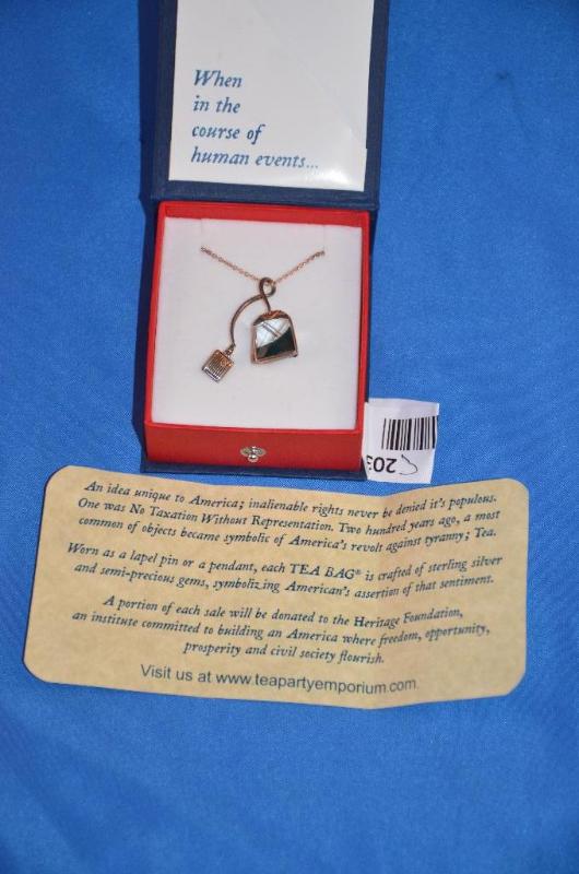 lot 203 image: Sterling Silver Tea Bag Pendant from Tea Part...