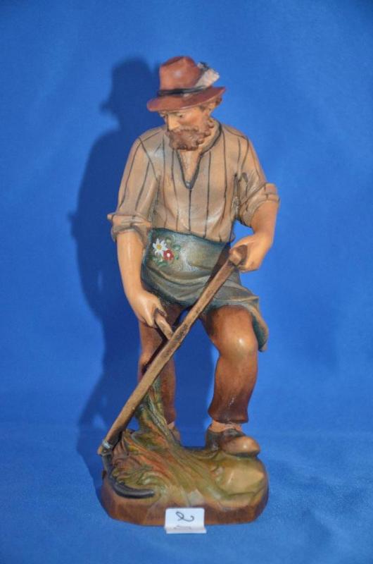 lot 213 image: Wood Carved Man with Scythe. Cannot read bott...