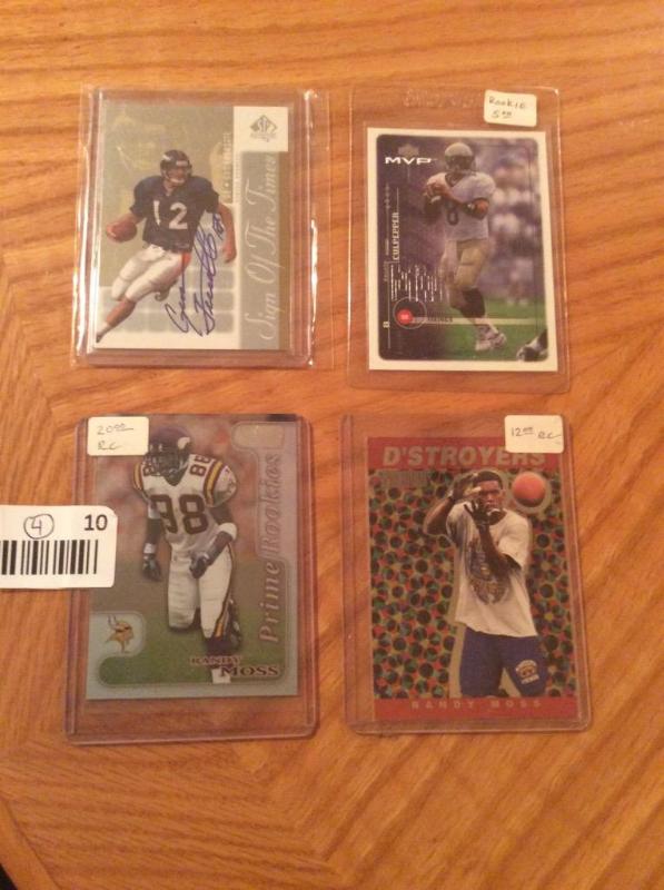 lot 10 image: Mint Lot of 4 Collectible High Value Football Cards - 2 Randy Moss Rookie, 1 Dante Culpepper Rookie, 1 Signed Gus Frerotte