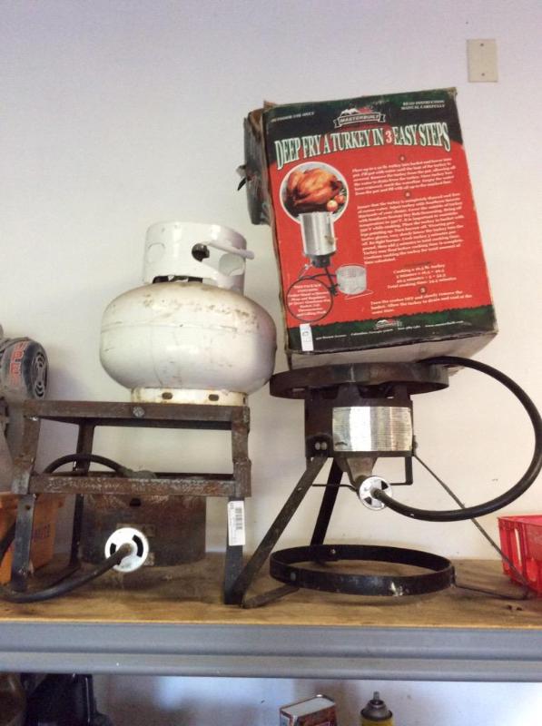 lot 107 image: 1 propane tank, 2 firing stands, turkey fryer...