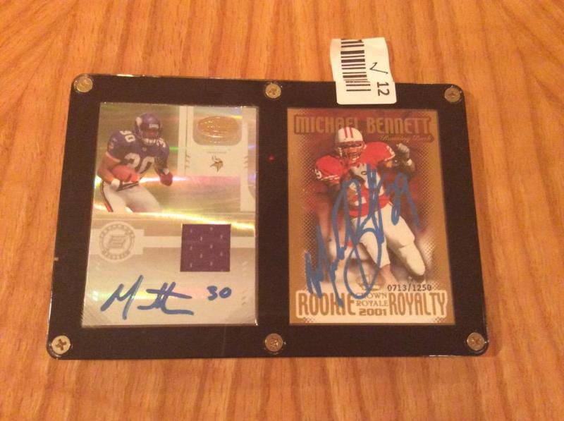 lot 12 image: Mint Lot of 2 Signed Collectible High Value Football Cards - 1 Michael Bennett Rookie, 1 Mewelde Moore wJersey Fabric