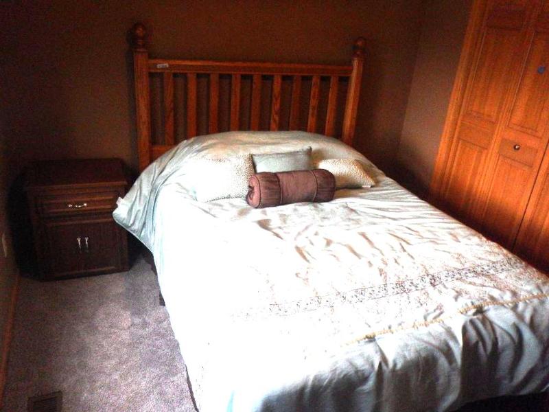 lot 141 image: Wood Headboard & nightstand with bedsprea...