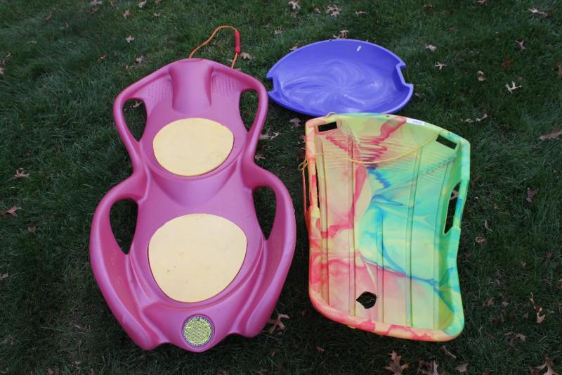 lot 171 image: Plastic toboggan type sleds. ...