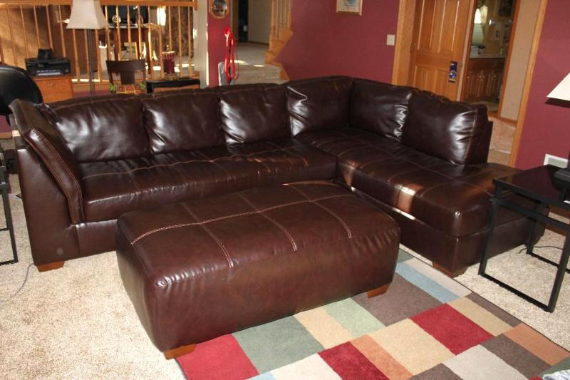 lot 23 image: Beautiful Chocolate DuraBlend Leather Stitched Sectional CouchSofa & Ottoman