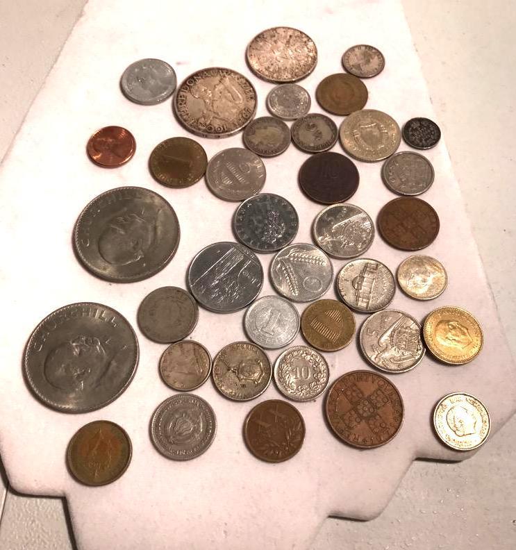 Large lot of foreign coins including Winston ...