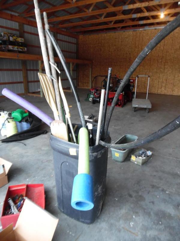 Garbage can and misc oars, pool noodles and hoses