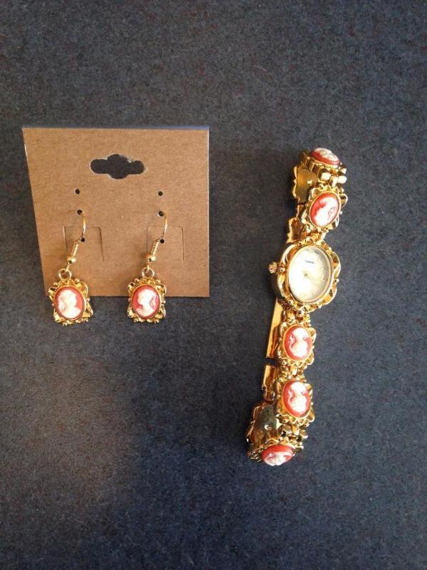 Brand new cameo watch and earring set. Gold t...