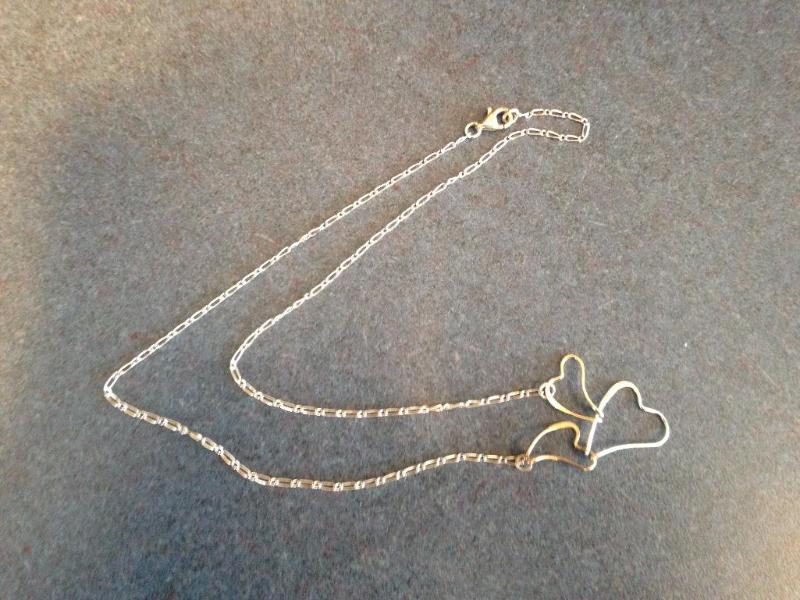 Triple hearts silver necklace. Marked 925 on ...