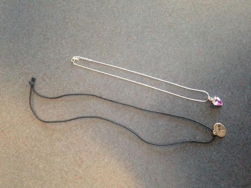 Amethyst color pendant, very pretty, on a cha...