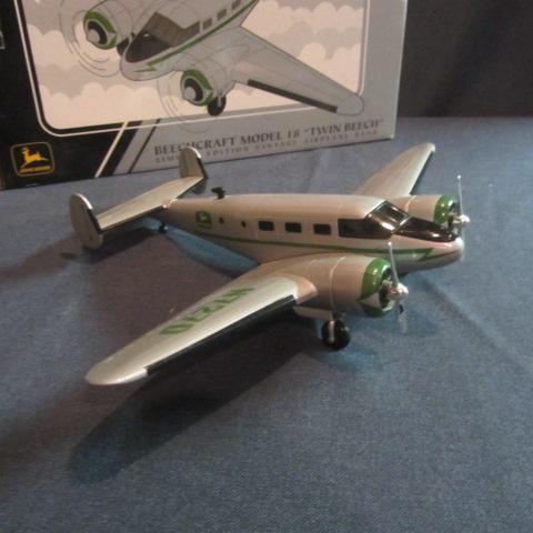 lot 56 image: John Deere Collector Airplane Bank