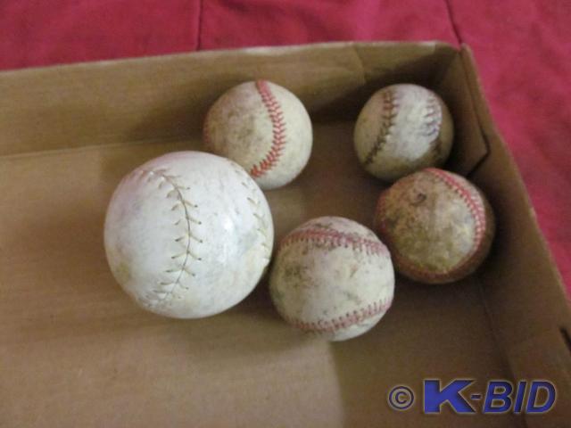 4 Baseballs, 1 Softball