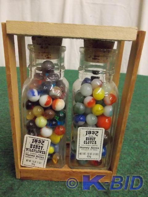 lot 62 image: 2-Old Honey Jars Filled With Marble...