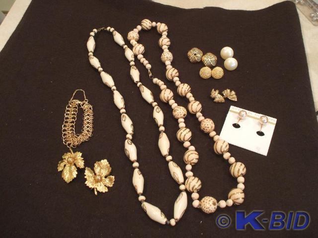 2 necklaces, 1 gold bracelet, 2 gol...