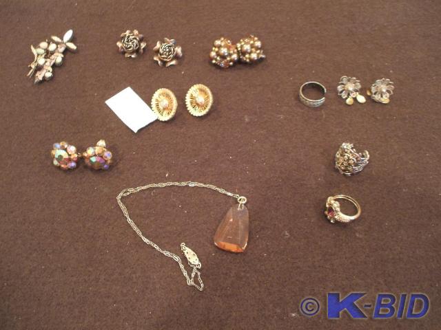 2 pins with stone designs-one pin i...