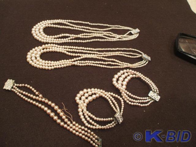 2 pearl necklaces that say Japan on...