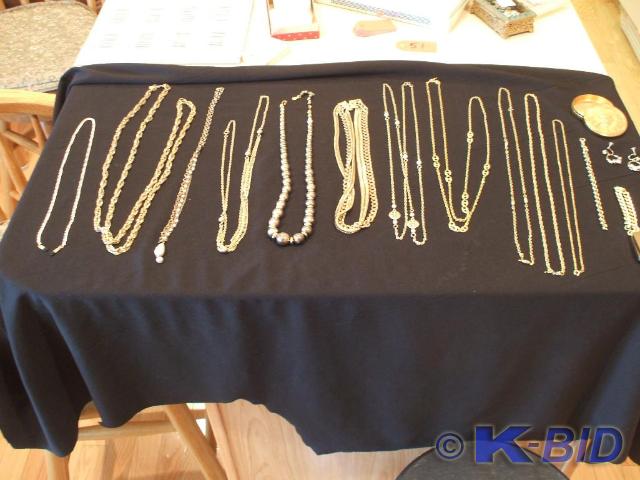 Eleven gold color necklaces of vari...