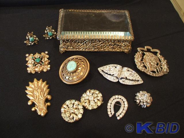 Gold color and rhinestone jewelry.&...