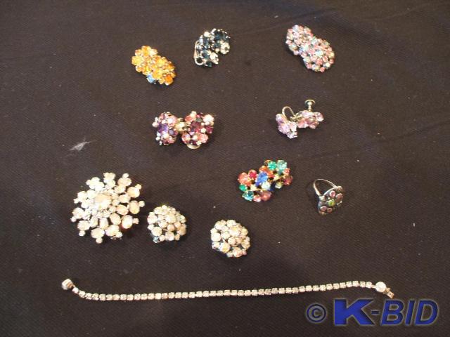 A rhinestone pin marked made in Aus...