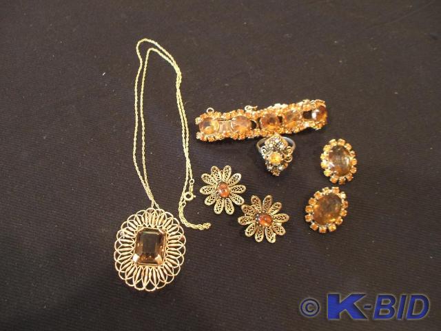 A 12 KT gold chain with a goldtone ...