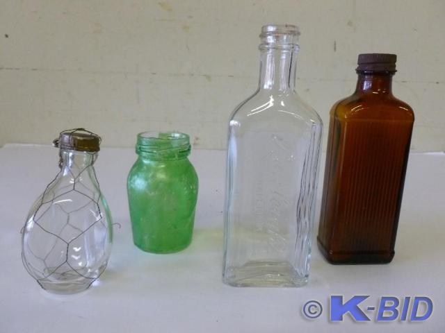Lot of four older glass product bot...