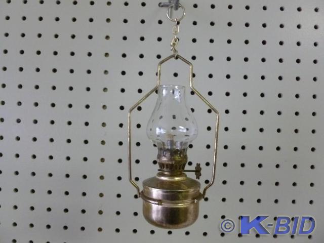 Metal bodied hanging oil lamp that ...