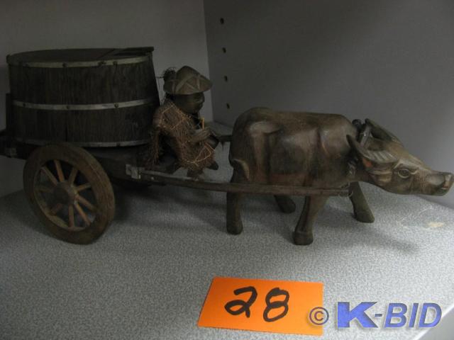 lot 28 image: Korean man on wagon pulled by water...