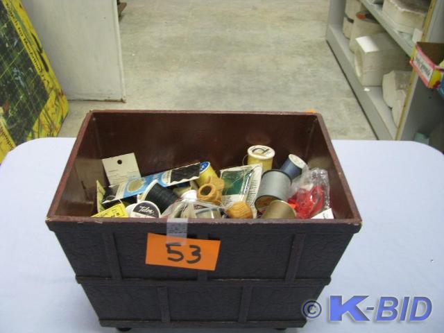 lot 53 image: three tins with sewing supplies
