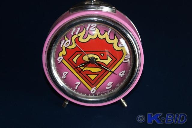 lot 190 image: Pink, Superman, Wind-up Clock, with...