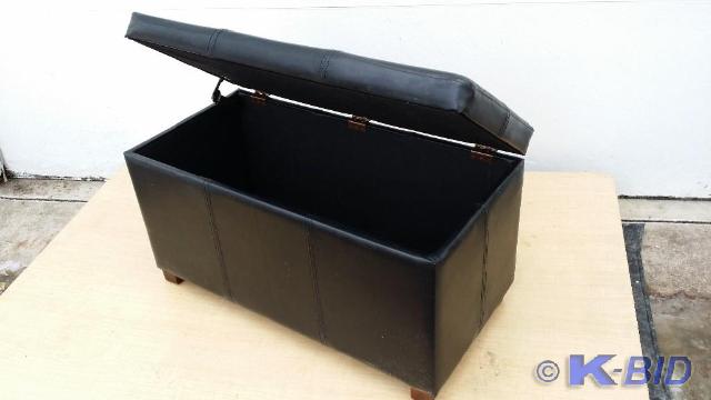 lot 5 image: Black leather look Ottoman, Opens u...