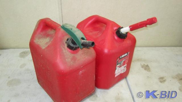 2 gas cans, 1 is full of bonfire st...