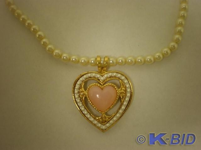 Heart shaped pearl like necklace.