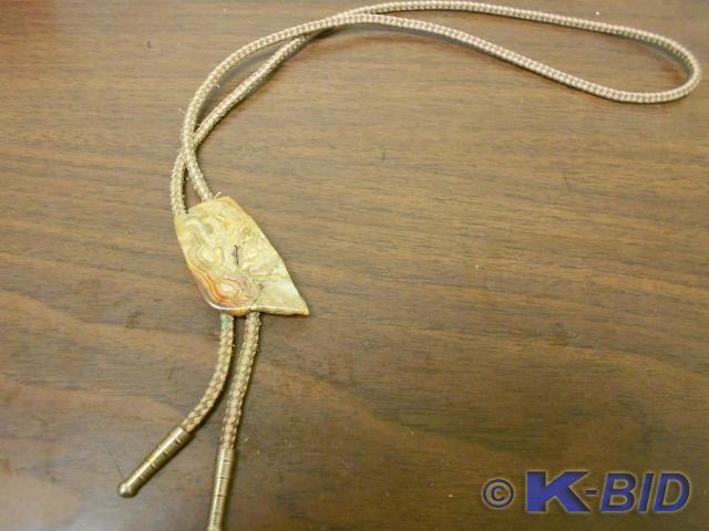 lot 100 image: Light brown tie with large unique b...