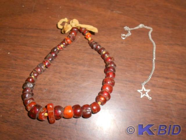 lot 68 image: Orange and red beaded bracelet with...