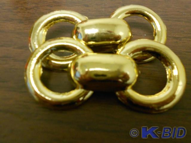 lot 90 image: Two gold bow tie clothing pins.