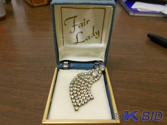 lot 92 image: Fair lady white diamond clothes pin...