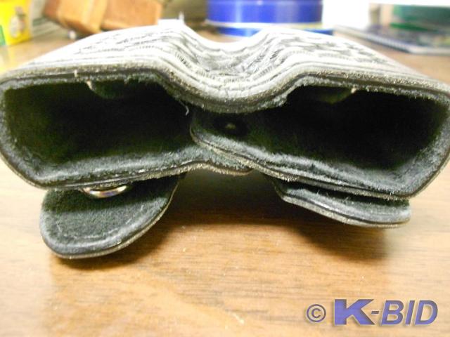 All black leather buckle carry case...