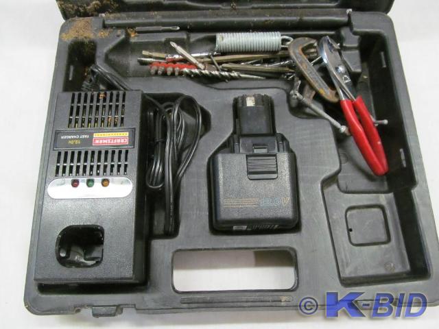 lot 125 image: Sears Craftsman 12V Battery and Cha...