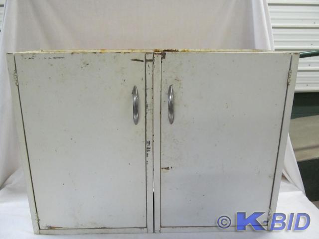 lot 143 image: 2 Door Metal Cabinet 30 x 22 x 10...