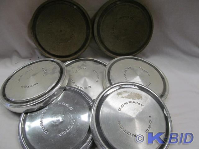 lot 18 image: Group of Ford Motor Hub Caps (7)
