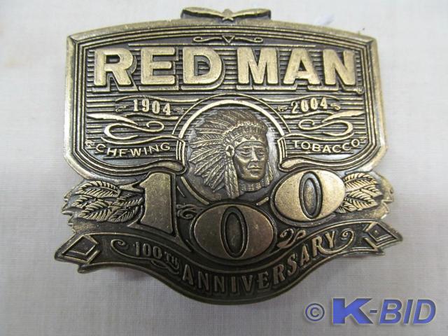 lot 68 image: Red Man Belt Buckle, 100th Annivers...