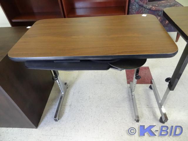 lot 16 image: Adjustable height table. 36 x 20. P...