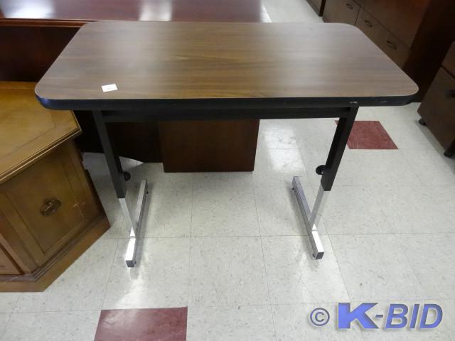lot 36 image: Adjustable height table on wheels. ...