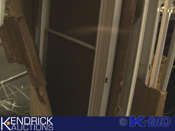 lot 207 image: Lot of 5 Storm Doors, Slabs, and Miscellaneous Parts