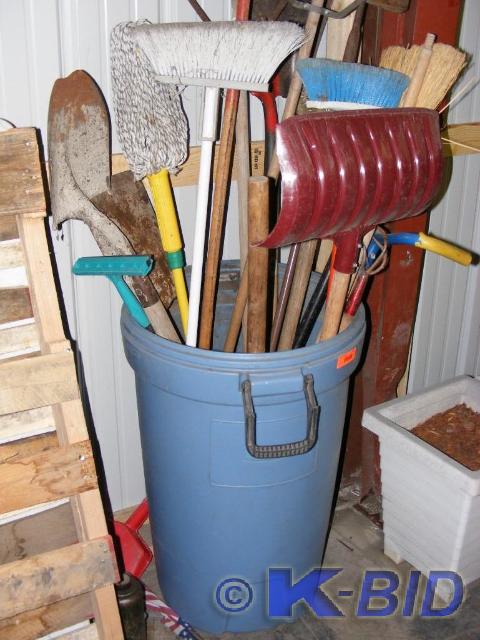 blue garbage can with contents, bro...
