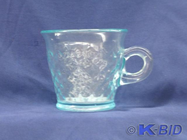 Light Blue glass cup approx 3.25 in...