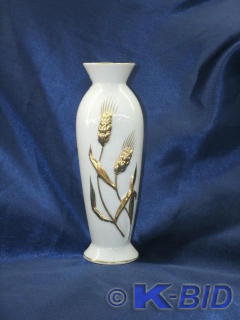 Light blue vase with sheave of whea...