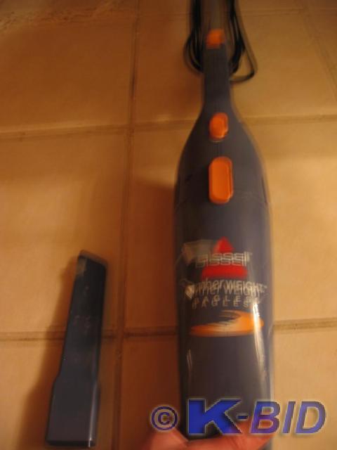 lot 102 image: Bissell small hand vacuum model 310...